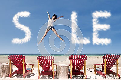 Advertising sale cloud and girl jump over beach chairs Stock Photo