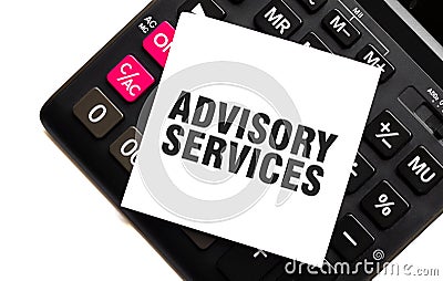 ADVISORY SERVICES on white sticker with calculator on white sticker with calculator Stock Photo