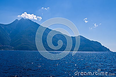 Aegean sea, silhouette of the holy mountains Athos and a small cloud above the mountain top Stock Photo