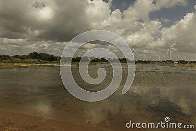 Aeolic turbines on the Guamare beach Stock Photo
