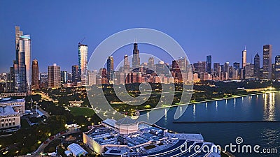 Aerial above aquarium with city lights at night reflection on Lake Michigan harbor water, Chicago IL Editorial Stock Photo