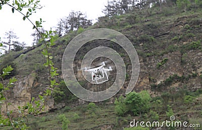 White drone flying in the air Stock Photo