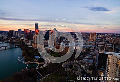 Aerial Austin Texas Sunset Golden Hour skyline pink Horizon and Golden reflections off Skyscrapers Editorial Stock Photo