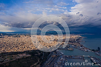 Aerial Barcelona panorama before storm. City with shadows from clouds. Moody weather. Spring in Barcelona Spain Stock Photo