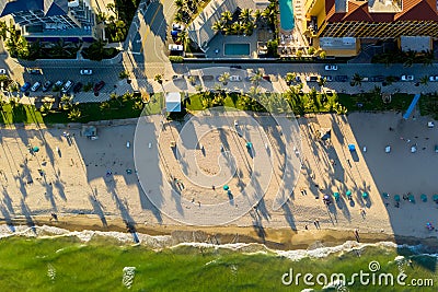 Aerial beach photo at dusk long palm tree shadows Stock Photo