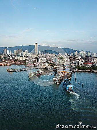 Aerial blue ferry arrive Penang Terminal. Editorial Stock Photo