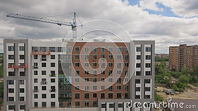 Aerial Building Process of Construction Site. Engineers crane and city Editorial Stock Photo