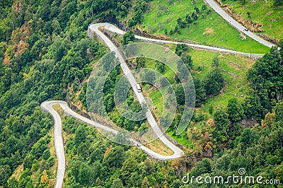 Aerial close-up view of a zig-zag winding road going up a steep slope near Geiranger, Norway Stock Photo