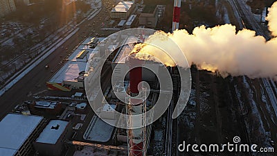 Aerial down view of an air polluting industrial smoke stack in the city Stock Photo