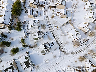 Aerial down view to on covered houses and roads at winter season courtyards covered snow with snow Stock Photo