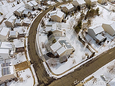 Aerial down view to on covered houses and roads at winter season courtyards covered snow with snow Stock Photo