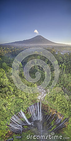 Aerial drone image of Tumpak Sewu waterfall and Mount Semeru in Java, Indonesia Stock Photo