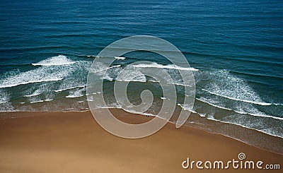 Aerial drone panorama of isolated surfer with surfboard on Praia da Cordoama beach idyllic landscape Algarve Portugal Stock Photo