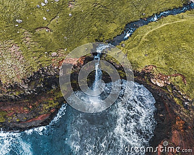 Aerial drone panorama of Mulafossur waterfall, Vagar, Faroe Islands, Denmark. Rough see in the north atlantic ocean Stock Photo