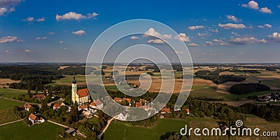 Aerial drone panorama of the village Eichlberg near Hemau with church of pilgrimage and surrounding rural area on top of a hill in Stock Photo