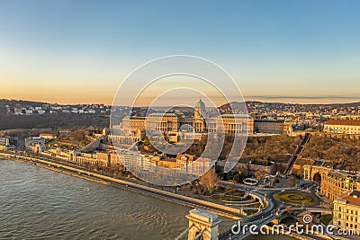 Aerial drone shot of Buda castle on Buda hill during Budapest sunrise morning glow Stock Photo
