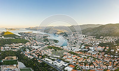 Aerial drone shot of Lapad Dubrovnik bridge with sunrise over peak in Croatia summer morning Stock Photo