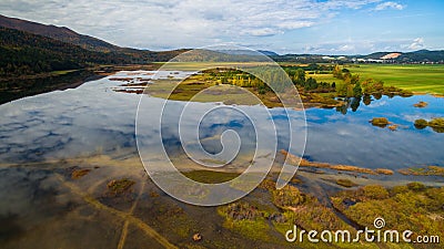 Aerial drone view of amazing autumn colors on the lake. Cerknisko lake, Slovenia Stock Photo