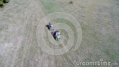 Aerial drone view of ATV quads on a dirt trail in forests. Off-road group team club enthusiasts having fun while driving Editorial Stock Photo