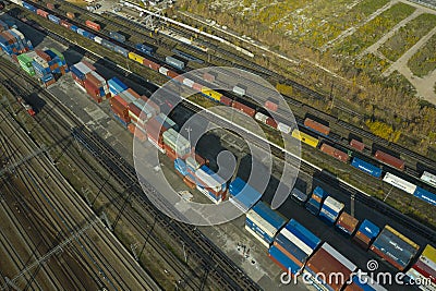 Aerial drone view on container railway hub with raiway freight platforms, containers storage area, rail road trucks and infrastruc Editorial Stock Photo