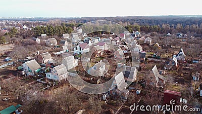 Aerial Drone View Flight Over small brick houses with plot of land in the middle Stock Photo