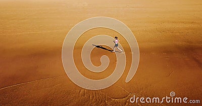 Aerial Drone View Of Healthy Sportive Woman Running On Beach Stock Photo