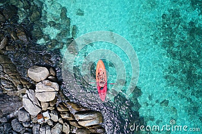 Aerial drone view of in kayak in crystal clear lagoon sea water during summer day near Koh Lipe island in Thailand. Stock Photo