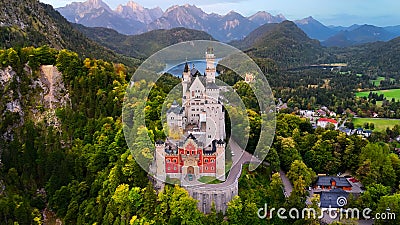 Aerial drone view Neuschwanstein castle on Alps background in vicinity of Munich, Bavaria, Germany, Europe. Autumn Stock Photo