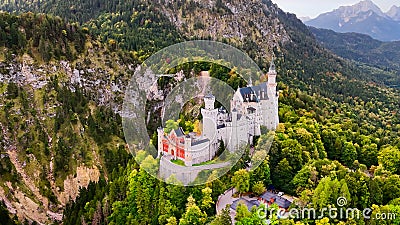 Aerial drone view Neuschwanstein castle on Alps background in vicinity of Munich, Bavaria, Germany, Europe. Autumn Stock Photo