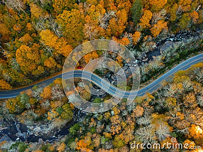 Aerial Drone view of overhead colorful fall / autumn leaf foliage near Asheville, North Carolina.Vibrant red, yellow, teal, orange Stock Photo