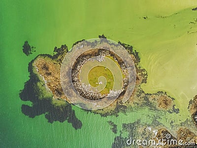 Aerial drone view on a small island in the ocean. West coast of Ireland Stock Photo