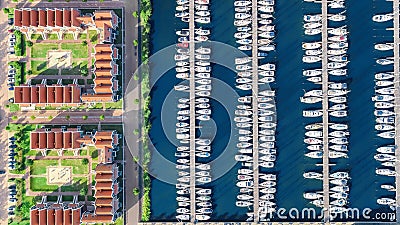 Aerial drone view of typical modern Dutch houses and marina in harbor, architecture of port of Volendam town, Holland, Netherlands Stock Photo