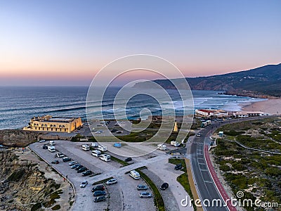 Aerial dronephoto of Praia do Guincho Beach and Hotel Fortaleza at sunset in Sintra, Portugal Stock Photo