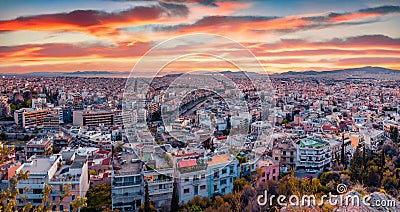 Aerial evening cityscape of Athens. Urban spring scene of Greece, Europe. Splendid sunset in the big sity. Stock Photo