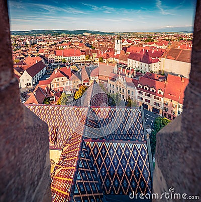 Aerial evening view of Altemberger House - Sibiu History Museum. Colorful cityscape of Sibiu town. Stock Photo