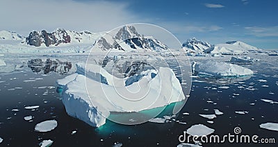 Aerial flight above giant iceberg melting hole Stock Photo