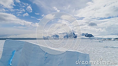 Aerial flight over Antarctica iceberg, ocean. Stock Photo