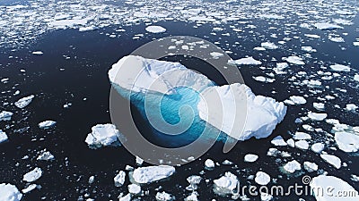 Aerial flight over iceberg among Antarctica ocean. Stock Photo
