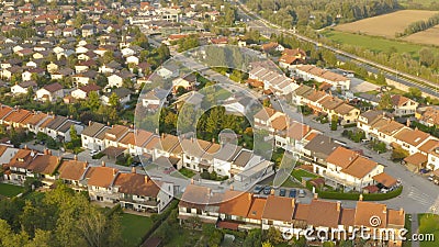 AERIAL: Flying above the middle class housing in a quiet suburban neighborhood. Stock Photo