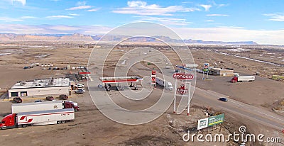 AERIAL: Flying around ConocoPhillips and Arby's sign board next to rest station. Editorial Stock Photo