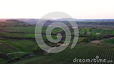 Aerial footage of an agricultural area and green rolling fields. Stock Photo