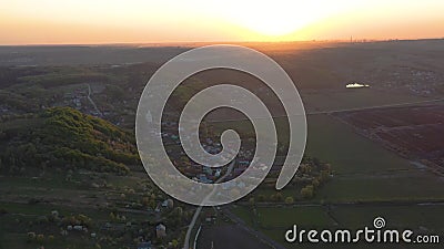 Aerial footage of an agricultural area and green rolling fields. Stock Photo