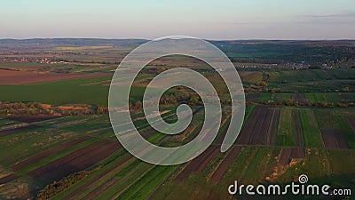 Aerial footage of an agricultural area and green rolling fields. Stock Photo