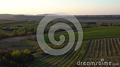 Aerial footage of an agricultural area and green rolling fields. Stock Photo