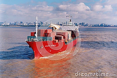view of a loaded container cargo vessel traveling over calm rio de la plata,buenos aires argentina,maqueira Editorial Stock Photo