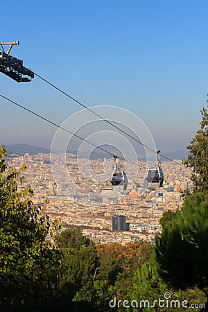 Aerial gondola lift with cable car and Barcelona cityscape panorama seen from Montjuic, Spain Stock Photo