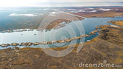 Aerial high view of Uros floating islands settlements at Lake Titicaca Stock Photo