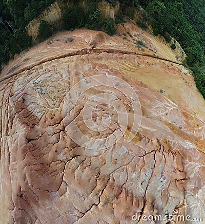 aerial scene of the land erosion due to deforestation and earth mining. Stock Photo