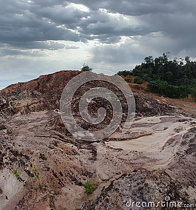 aerial scene of the land erosion due to deforestation and earth mining. Stock Photo