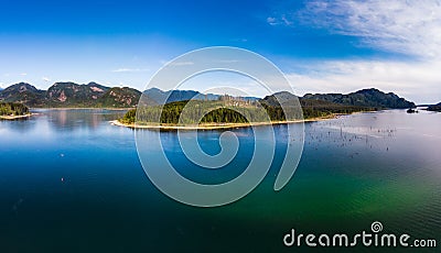 Aerial of lake surrounding island Stock Photo